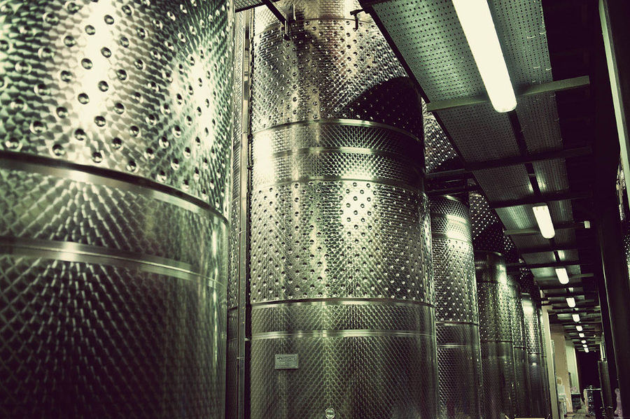 view of the midle of aluminum wine storage tanks at Domaine Papagiannakos plant